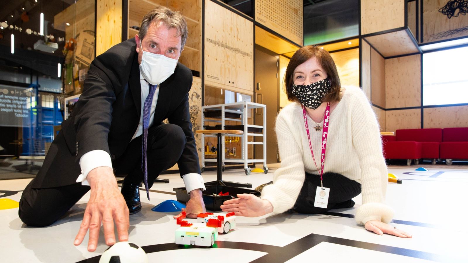 Metro Mayor Dan Norris plays robot football with Donna Speed, Chief Executive of We the Curious